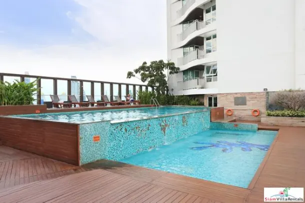 Convenient and Comfortable Two Bedroom Condo for Rent with Lots of Wood Accents in Lumphini 2